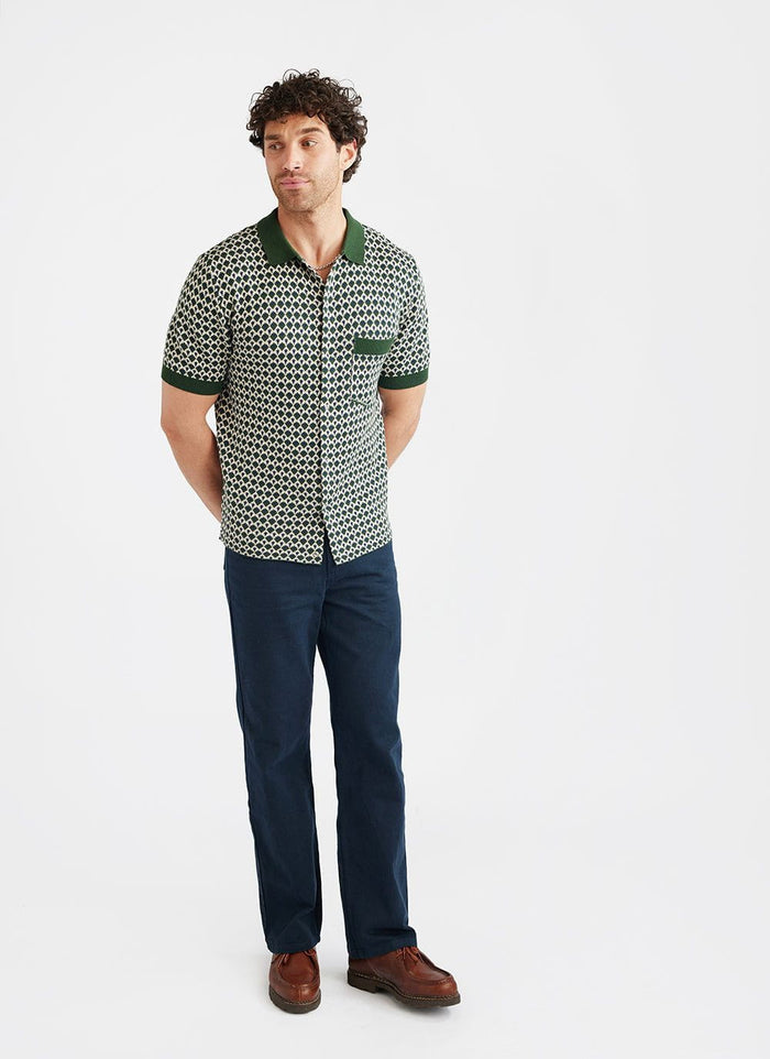 A model wears the Percival Casa Piccante Shirt in green jacquard, featuring a geometric pattern and solid green collar.