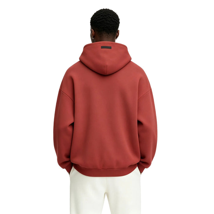 Fear of God Essentials Fleece Hoodie Crimson worn from the back