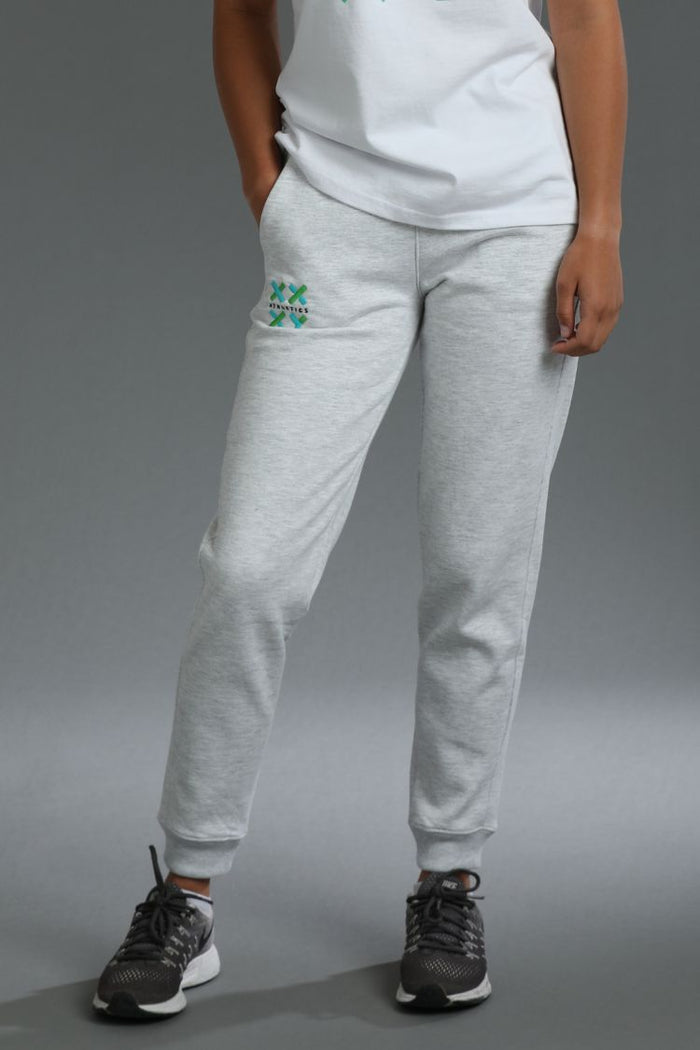 Person wearing gray sweatpants with a logo on a gray background || Light Heather Gray