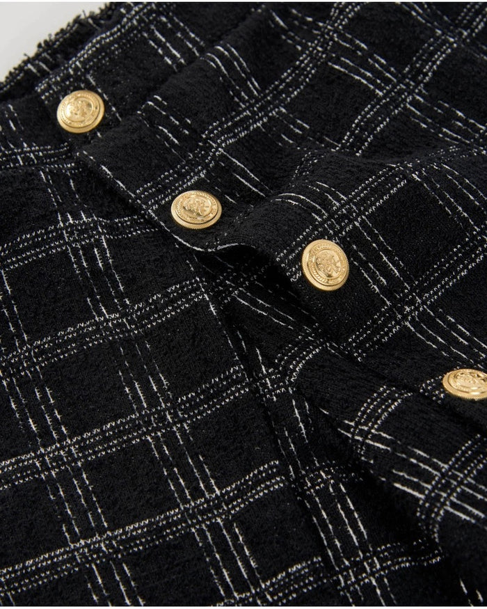 Girls’ black tweed shorts with checks and gold buttons