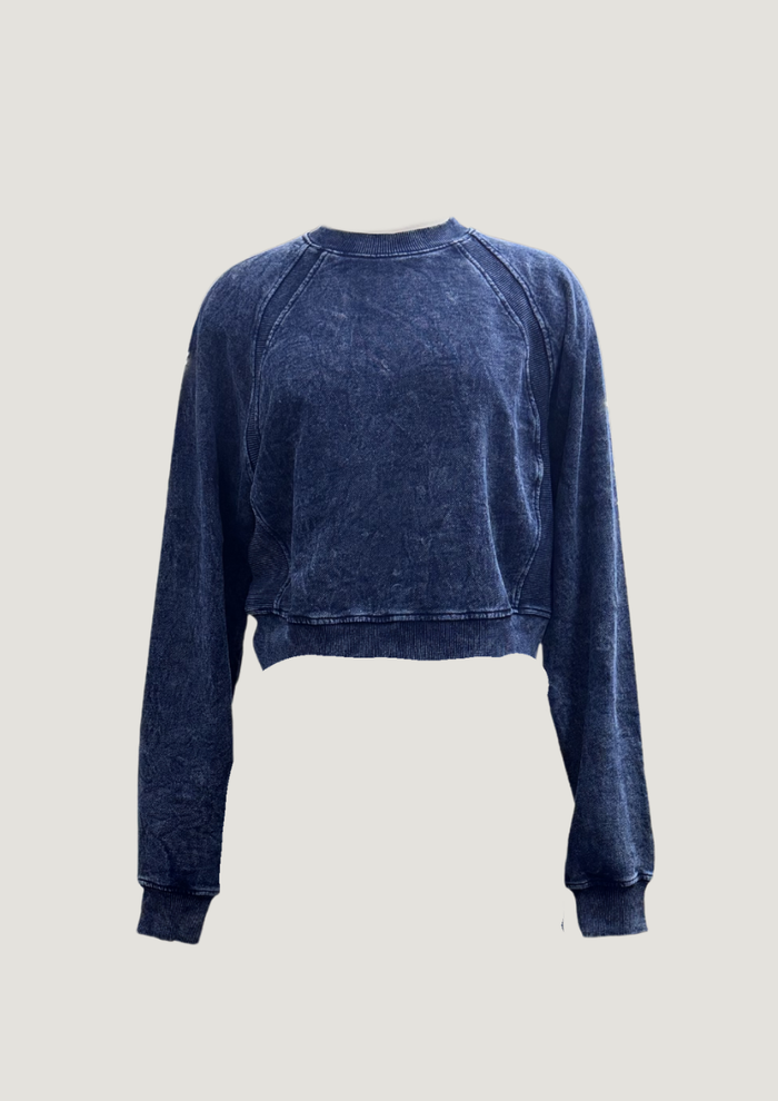 Side view of Indigo Rib Trim Sweatshirt in mineral wash on model