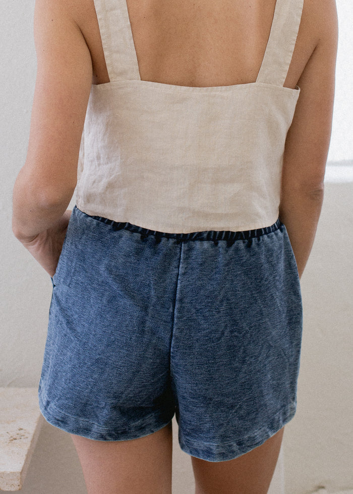 backside of woman wearing stretch denim shorts