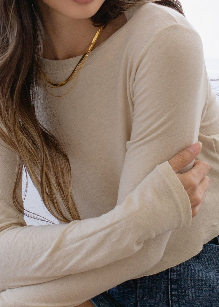 Close-up detail of Long Sleeve Baby Crop Tee on model