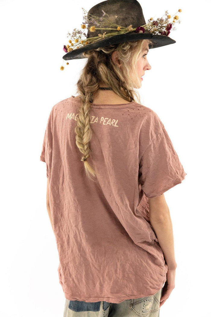 Magnolia Pearl artisan vintage pink shirt, woman with braid and whimsical floral hat