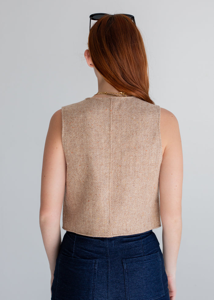 Side view of Wool Vest in sand on model