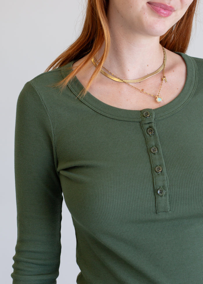 Close-up detail of 2x1 Long Sleeve Henley on model