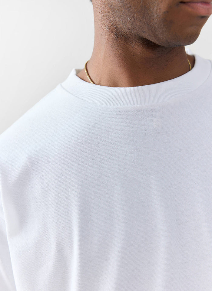 Close up of the white oversized organic cotton t-shirt from Percival showing the ribbed collar detail.