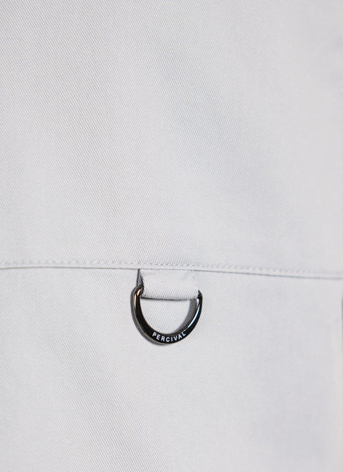 Close up of the Percival D-ring hardware detail on the light blue Auxiliary Boxy Clerk Shirt.