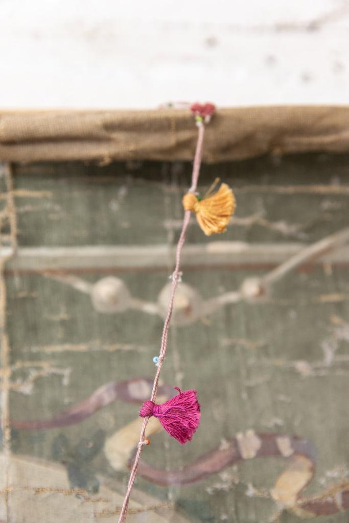 Magnolia Pearl artisan necklace with pink and yellow tassels, whimsical vintage style jewelry