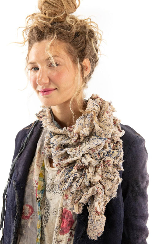 Woman wearing Magnolia Pearl artisan vintage floral ruffle scarf and navy jacket