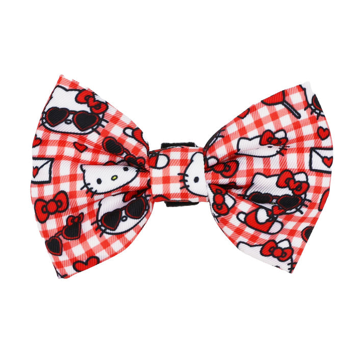 The Cat Bowtie - Hello Kitty® Red Classic by Sassy Woof features a red and white design that pops against plaid, ideal for any Hello Kitty fan.