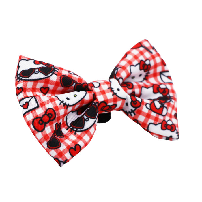 The Sassy Woof Cat Bowtie - Hello Kitty® Red Classic features a red and white checkered design with Hello Kitty faces and small red hearts—an adorable accessory for any Sanrio collection.