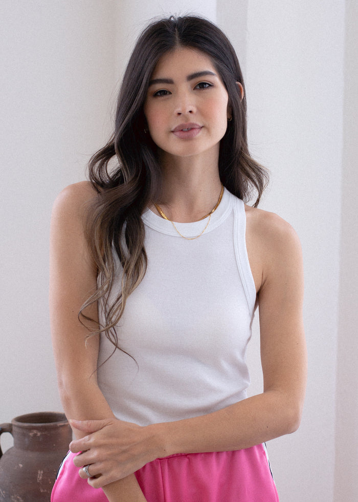 woman wearing rib tank with binding details in white