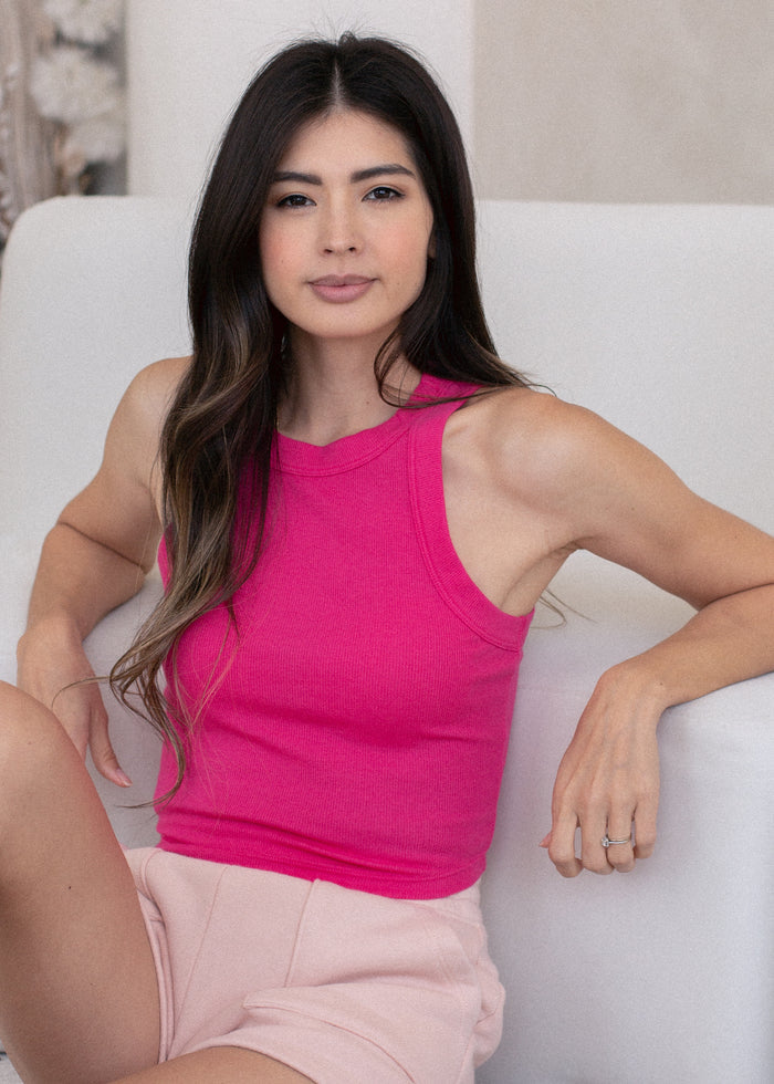 woman wearing rib tank with binding details in fuchsia