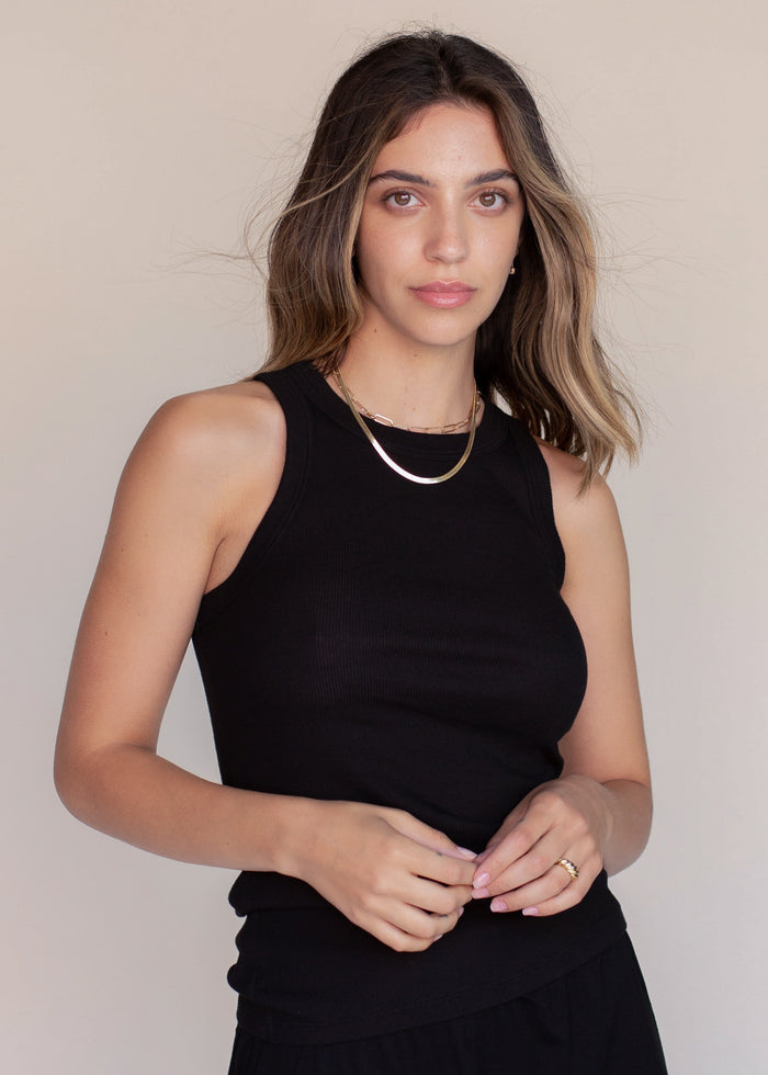 woman wearing rib tank with binding details in black