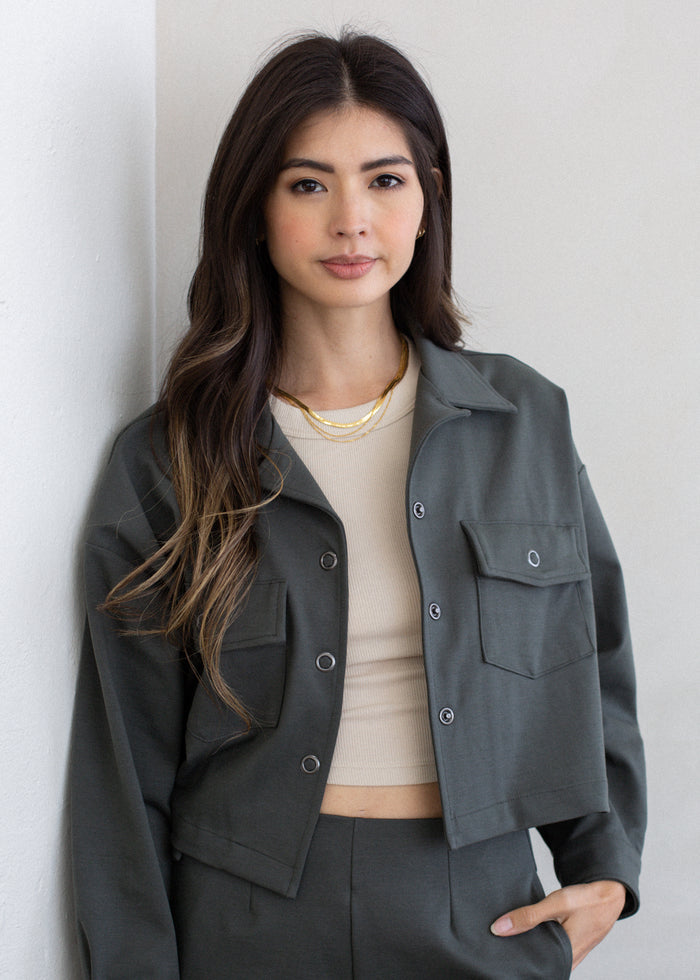 woman wearing rib tank with binding details in natural