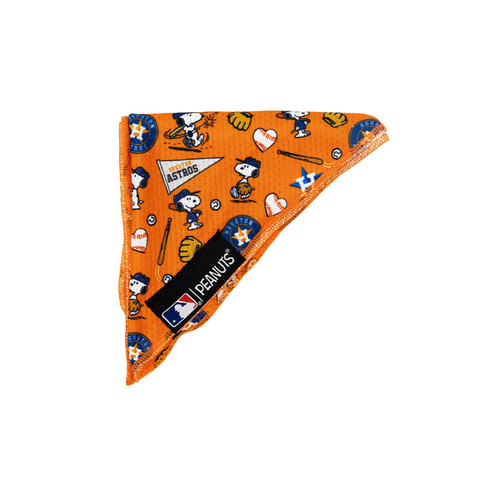 The Sassy Woof Dog Bandana - MLB™ x Peanuts™ Houston Astros™ features Peanuts characters, baseballs, hearts, and pennants on orange cooling mesh, folded to display both MLB and Peanuts branding on a black tag.