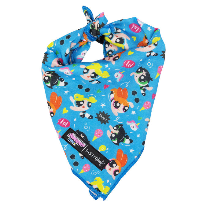 The Sassy Woof Dog Bandana - The Powerpuff Girls™ (Blue) is a lightweight cotton accessory decorated with colorful characters, hearts, stars, comic words like LOL and POW, and finished with a signature “Sassy Woof” tag.