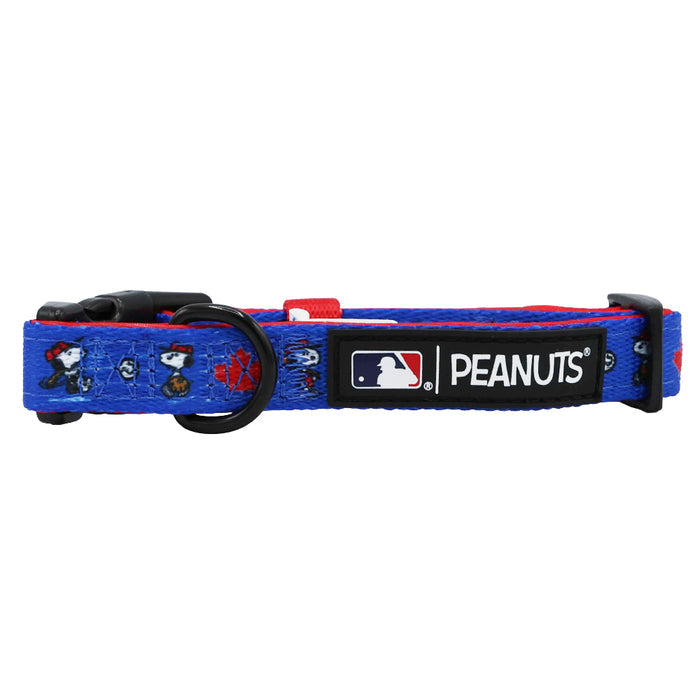 The Sassy Woof Dog Collar - MLB™ x Peanuts™ Toronto Blue Jays™ is a blue adjustable collar featuring Peanuts characters, baseball-themed graphics, a black buckle, and an MLB/Peanuts patch—ideal for any fan’s pet.