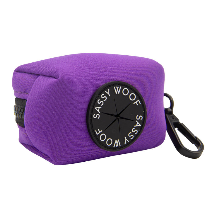 Experience coordinated style with the Sassy Woof Dog Collar Three Piece Bundle in Neon Purple. This bundle features a chic purple rectangular pouch with a zipper and a black circular Sassy Woof label, plus a handy black clip on one side—perfect for pairing seamlessly with your neon purple dog accessories or the matching neon leash for an eye-catching, unified look.