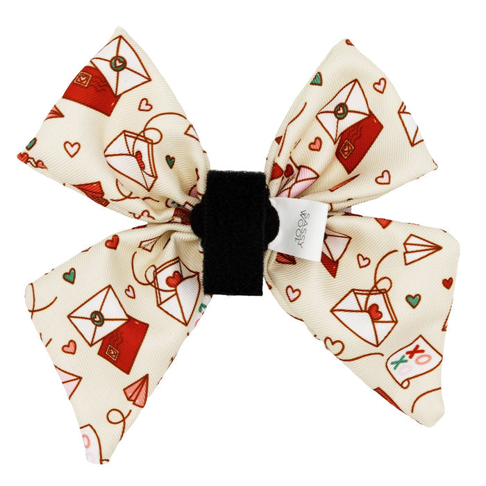 The Dog Sailor Bow - P.S. I Woof You by Sassy Woof is a charming accessory, perfect for anyone looking to add a heartfelt touch to their dog's look.