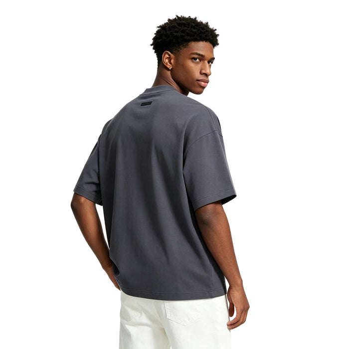 Fear of God Essentials Jersey Crewneck Tee Marine worn from the back