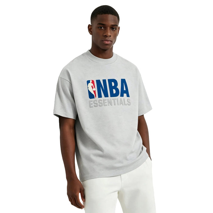 Fear of God Essentials NBA Tee Light Heather worn from the front