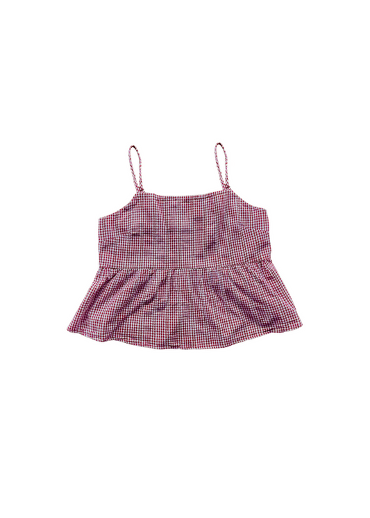 A pink and white gingham check camisole top with thin spaghetti straps and a ruffled peplum hem, shown flat on a white background.