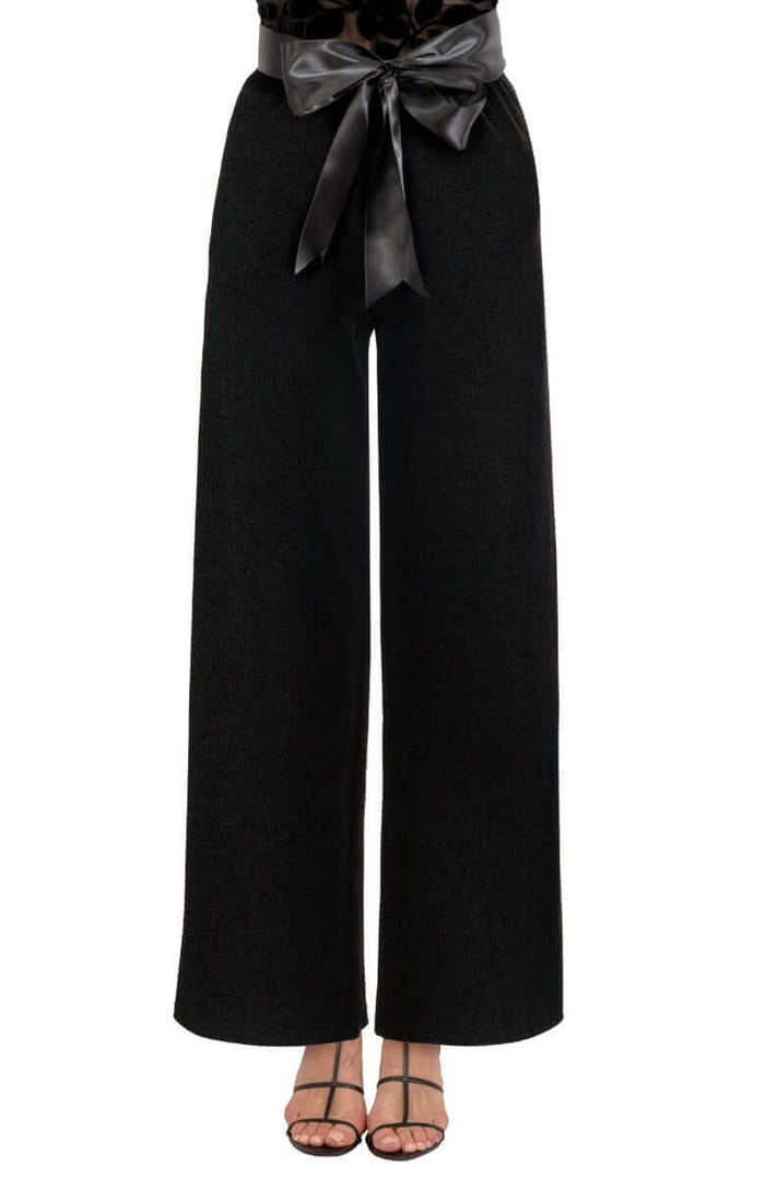 Black wide-leg velvet pants with a black satin bow belt on a white background