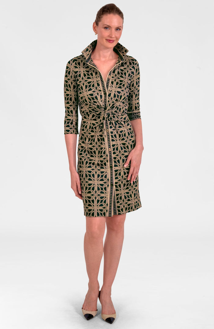 Woman wearing a patterned dress on a white background