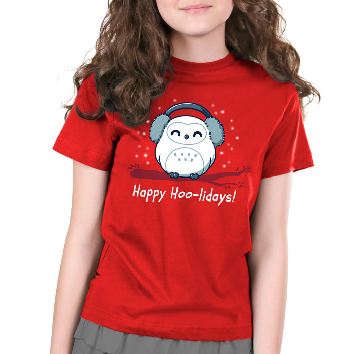 Premium Cotton T-shirt_TeeTurtle Happy Hoo-lidays red apparel featuring a cheerful snowy owl wearing earmuffs and sitting on a branch surrounded by falling snow.