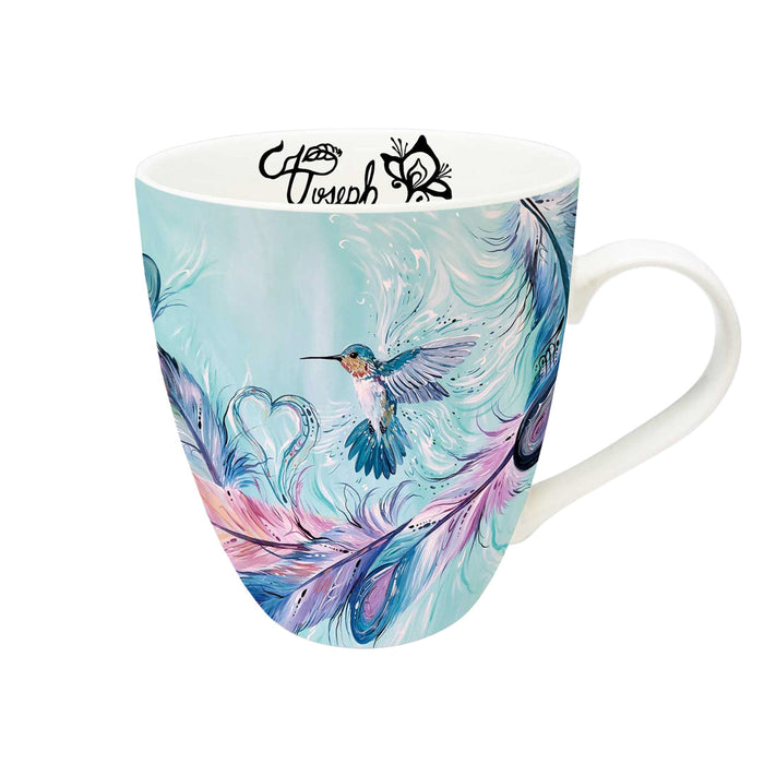 Mug with artistic design of a hummingbird and feathers on a white background