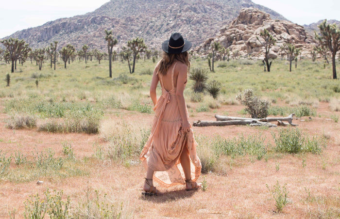 a female model wearing Jerusalem sandals starring at a mountain