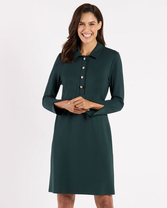 Model in the Jude Connally Midge Dress - Pine/Gold, a dark green dress with gold buttons and a shirt collar