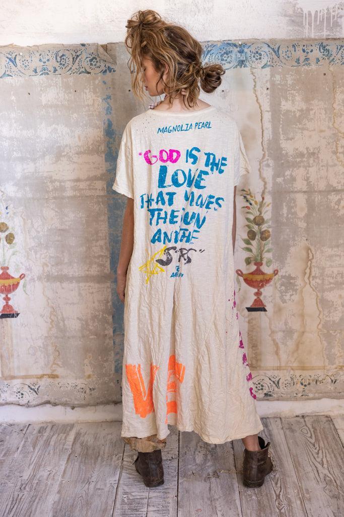 Woman wearing Magnolia Pearl artisan vintage dress with whimsical hand-painted text and designs