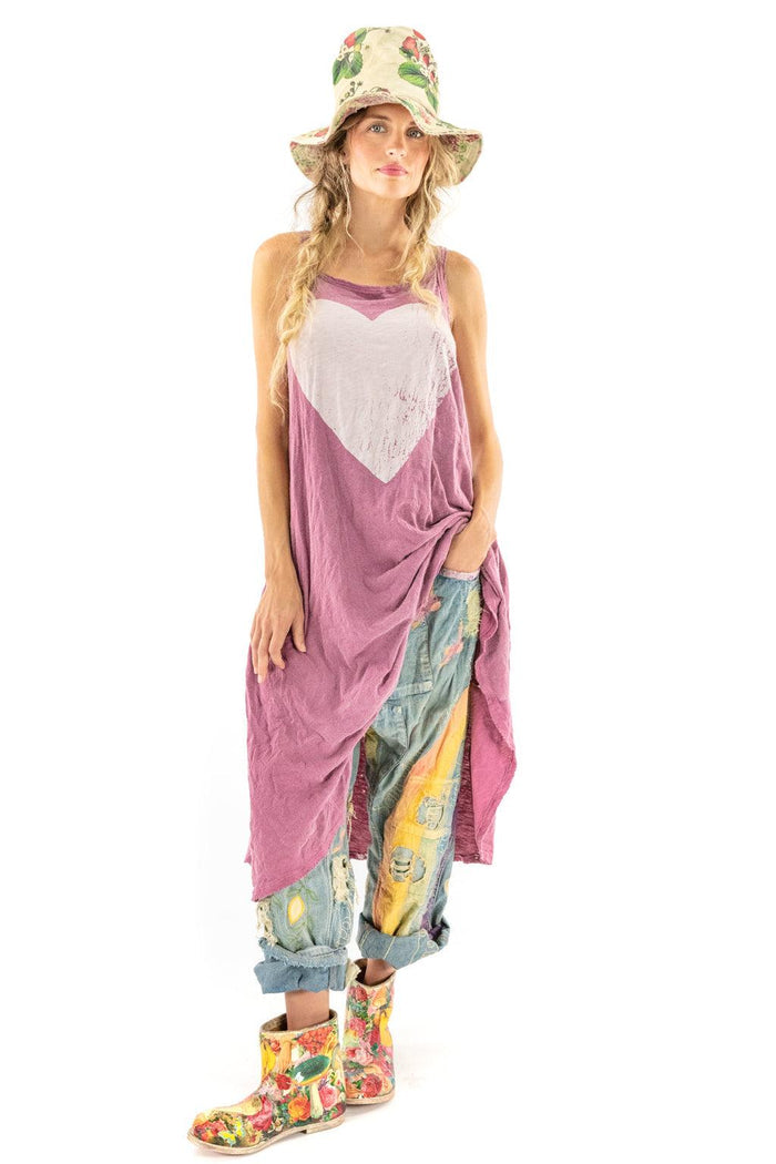 Magnolia Pearl model in vintage-inspired artisan dress with heart print, floral hat and boots