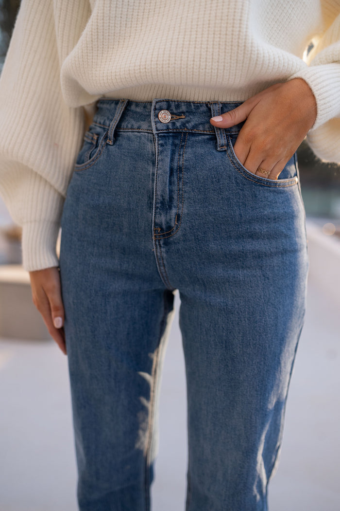 Front view of high-rise medium-blue denim