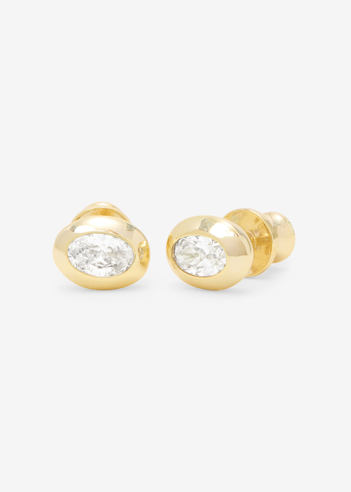Gold framed simulated diamond earrings on a white background