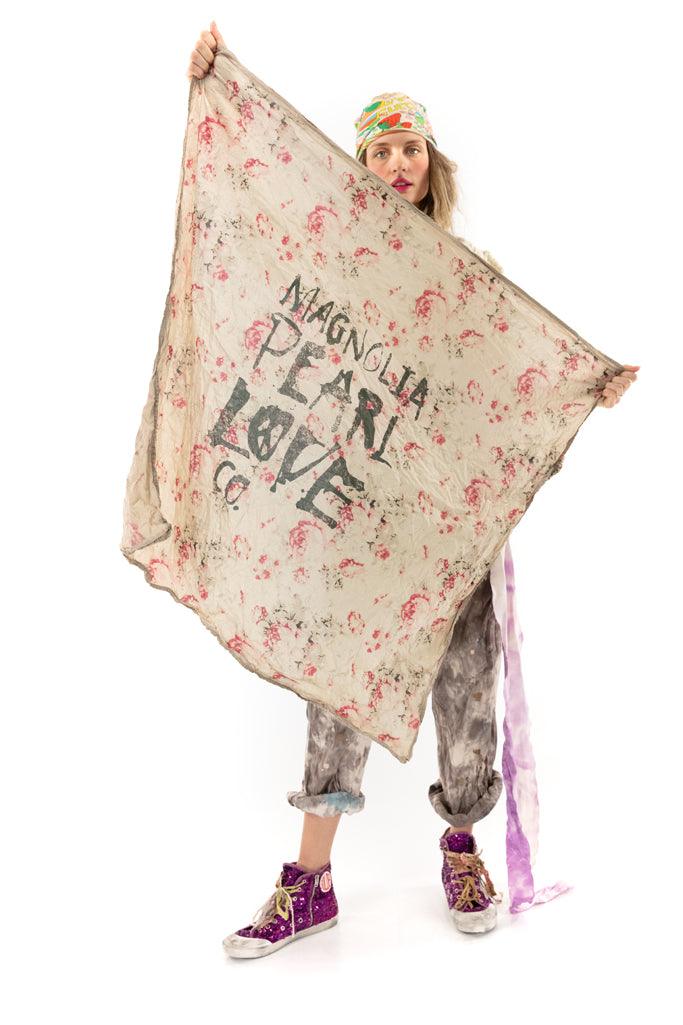 Whimsical Magnolia Pearl vintage floral scarf with hand-painted text, modeled with artisan style