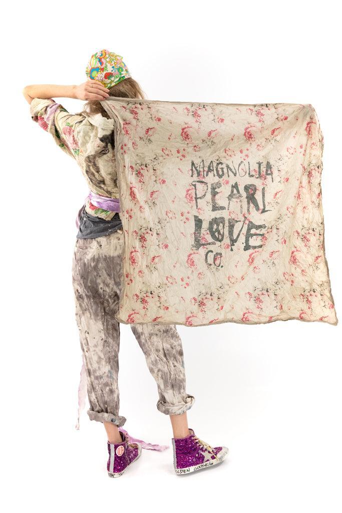 Magnolia Pearl artisan floral scarf with whimsical vintage style, model in unique boho clothing