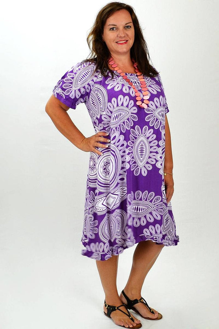 Misha purple and white patterned tunic with long sleeves and relaxed fit, displayed on a hanger.
