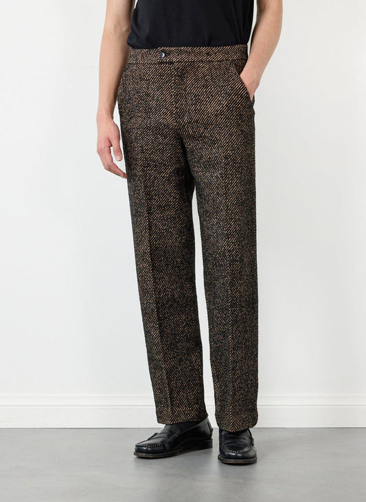 A model wears the Percival straight leg slack trousers in an oak and black twill fabric.