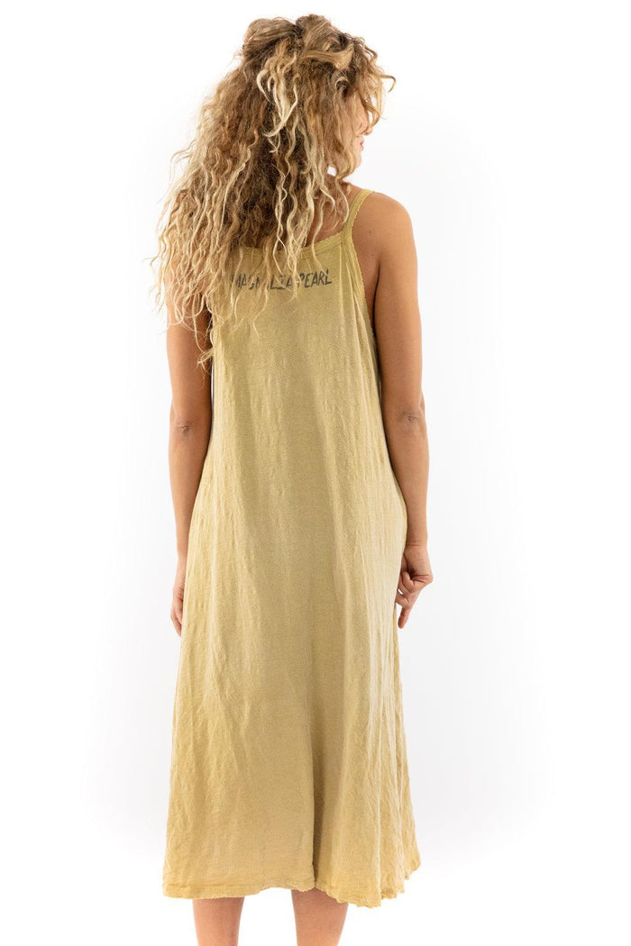 Woman wearing Magnolia Pearl artisan vintage yellow dress with whimsical, unique style