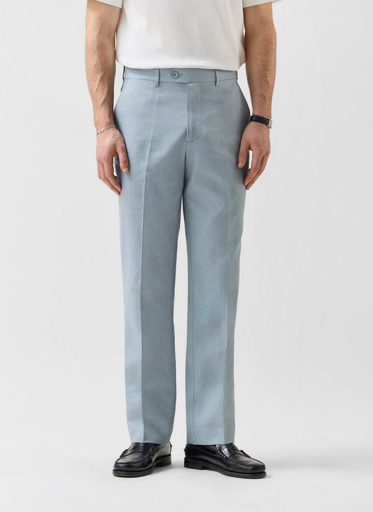 Percival light blue tailored linen trousers on a man wearing a white t-shirt and black loafers