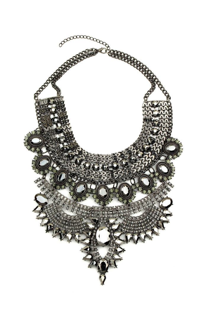Zania Pewter Necklace with a black tone chain, layered collar silhouette, and glass crystal embellishments in a structured tiered design.